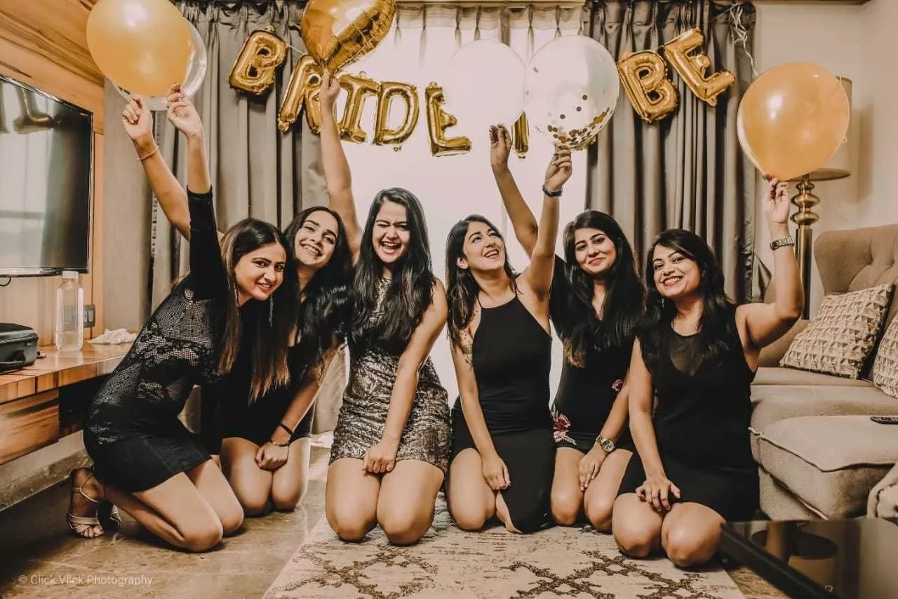 Six girls at a Bachelorette party with balloons