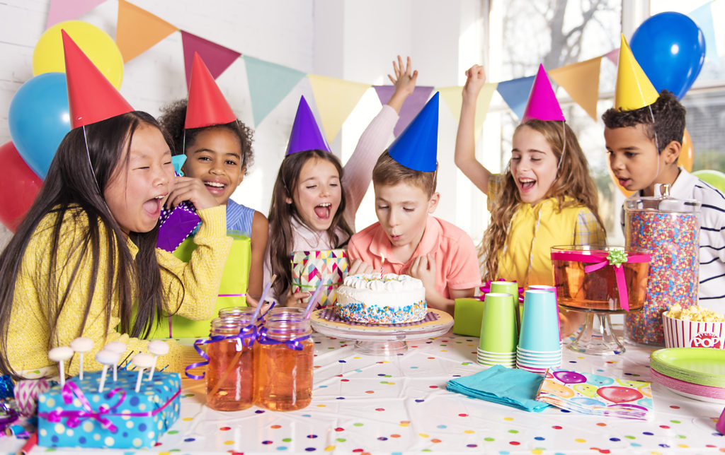 Children around the birthday cake